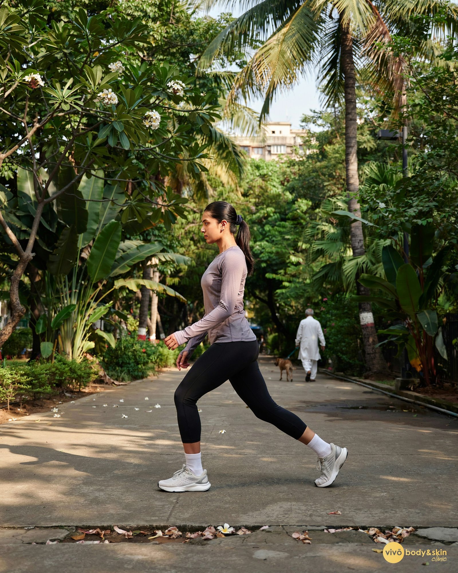 Woman exercising in a park, working on leg and thigh toning